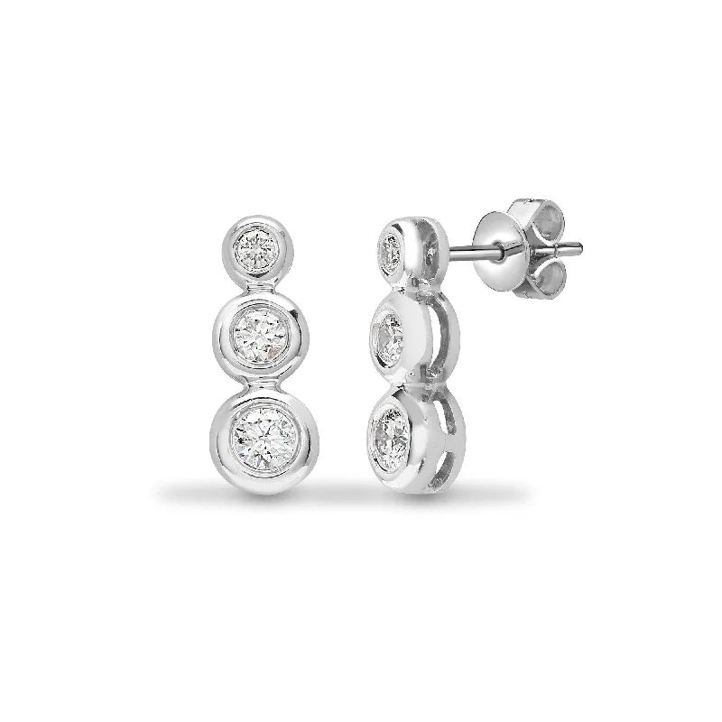 Ladies cubic zirconia stud earrings-DIAMOND THREE-STONE RUB OVER SETTING DROP EARRINGS IN 18K WHITE GOLD