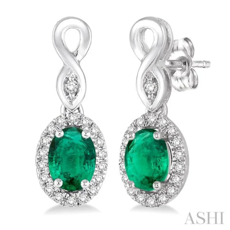 Ladies bridal earrings-5x3 MM Oval Cut Emerald and 1/6 Ctw Round Cut Diamond Earrings in 10K White Gold