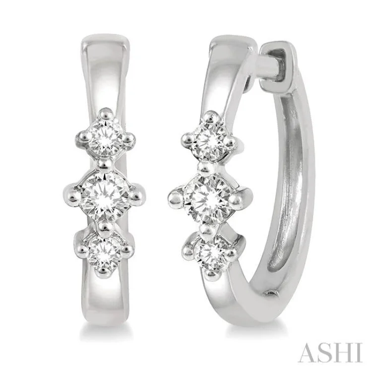 Ladies small hoop earrings-1/6 Ctw Three Stone Round Cut Diamond Huggie Earrings in 10K White Gold