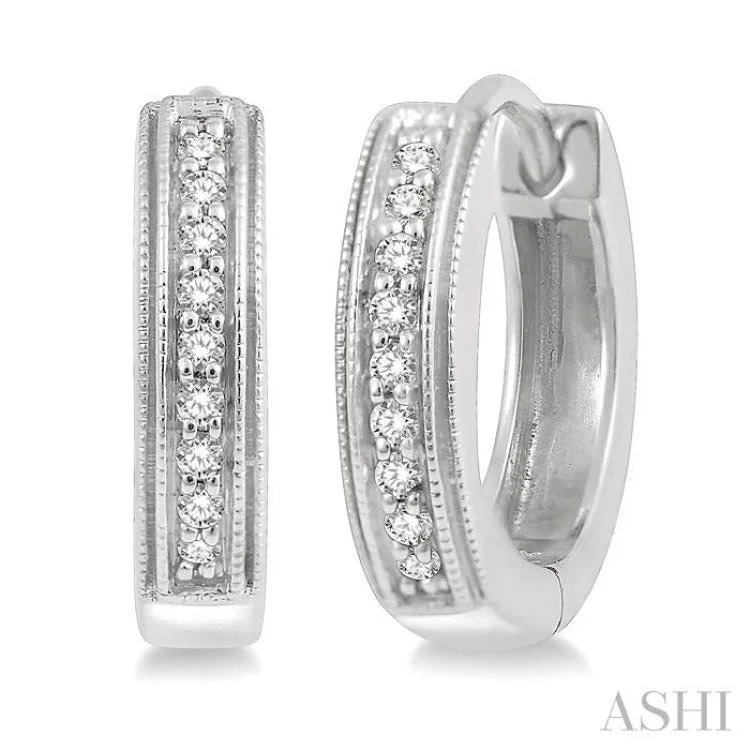 Ladies personalized earrings-1/10 Ctw Scooped Center Round Cut Diamond Huggie Earrings in 10K White Gold